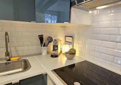 Cuisine ou kitchenette dans l'établissement Chez Maëlle - Tour Eiffel Cosy Flat