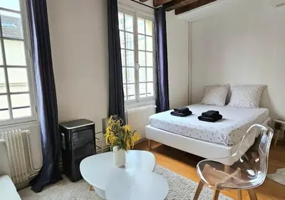 Un ou plusieurs lits dans un hébergement de l'établissement Chez Maëlle - Tour Eiffel Cosy Flat