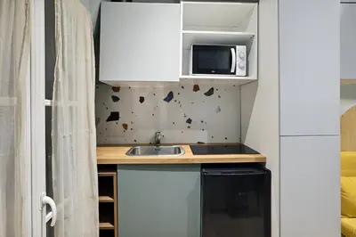 Cuisine ou kitchenette dans l'établissement 503 Suite Pergolèse - Charmant Studio in Paris