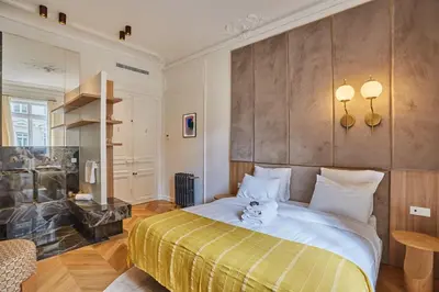 Un ou plusieurs lits dans un hébergement de l'établissement Apartment Opera Vendome by Studio Prestige