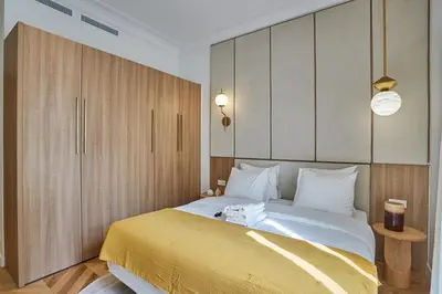 Un ou plusieurs lits dans un hébergement de l'établissement Apartment Opera Vendome by Studio Prestige