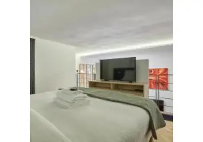 Un ou plusieurs lits dans un hébergement de l'établissement Duplex Center of Paris by Studioprestige