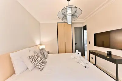 Un ou plusieurs lits dans un hébergement de l'établissement Appartement luxueux Musée du Louvre - Rivoli