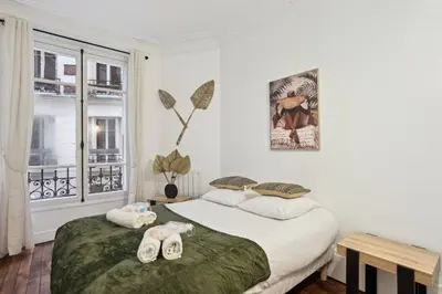 Un ou plusieurs lits dans un hébergement de l'établissement 523 Suite Batignolles - Superbe Appartement