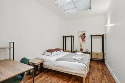 Un ou plusieurs lits dans un hébergement de l'établissement 523 Suite Batignolles - Superbe Appartement
