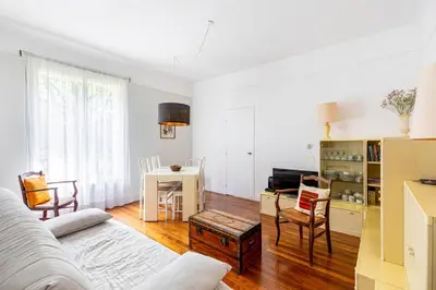Télévision ou salle de divertissement dans l'établissement GuestReady - Charmant appartement dans le 16ème