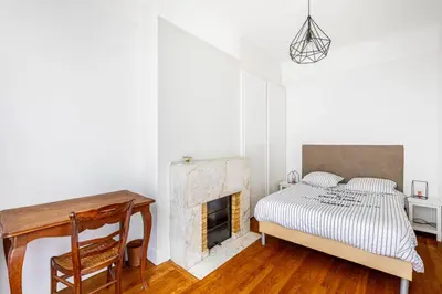 Un ou plusieurs lits dans un hébergement de l'établissement GuestReady - Charmant appartement dans le 16ème