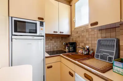 Cuisine ou kitchenette dans l'établissement GuestReady - Charmant appartement dans le 16ème