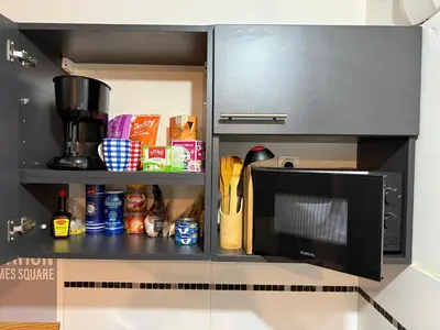 Cuisine ou kitchenette dans l'établissement Appartement à 15 mins de Paris