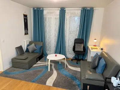 Coin salon dans l'établissement Appartement à 15 mins de Paris