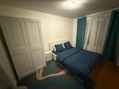 Un ou plusieurs lits dans un hébergement de l'établissement Appartement à 15 mins de Paris