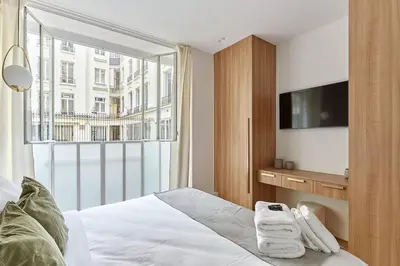 Un ou plusieurs lits dans un hébergement de l'établissement Sublime 3 bedrooms Apartment Center of Paris by Studio Prestige