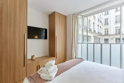 Un ou plusieurs lits dans un hébergement de l'établissement Sublime 3 bedrooms Apartment Center of Paris by Studio Prestige