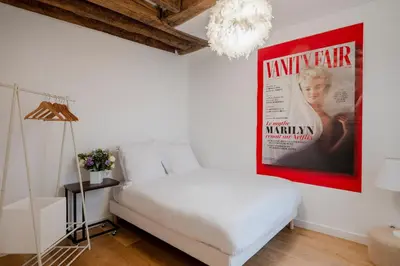 Un ou plusieurs lits dans un hébergement de l'établissement Paris Center Greneta residence
