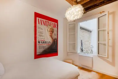 Un ou plusieurs lits dans un hébergement de l'établissement Paris Center Greneta residence