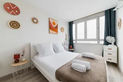 Un ou plusieurs lits dans un hébergement de l'établissement Appartement Versailles Eiffel