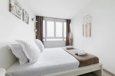 Un ou plusieurs lits dans un hébergement de l'établissement Appartement Versailles Eiffel