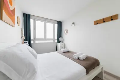 Un ou plusieurs lits dans un hébergement de l'établissement Appartement Versailles Eiffel