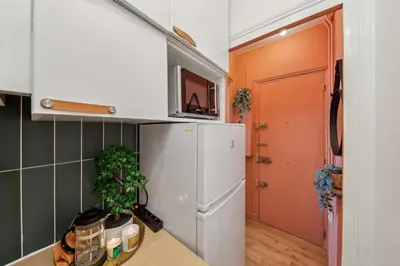 Cuisine ou kitchenette dans l'établissement Appartement Cosy à 2 pas de Paris