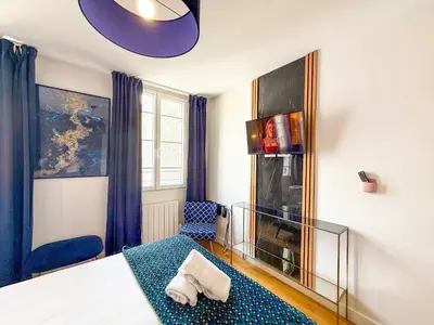 Un ou plusieurs lits dans un hébergement de l'établissement Urban Flat 176 - Charming 3 Bedroom in Montorgueil
