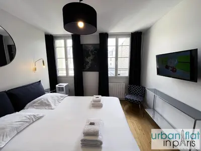 Un ou plusieurs lits dans un hébergement de l'établissement Urban Flat 176 - Charming 3 Bedroom in Montorgueil