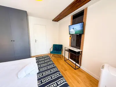 Un ou plusieurs lits dans un hébergement de l'établissement Urban Flat 176 - Charming 3 Bedroom in Montorgueil