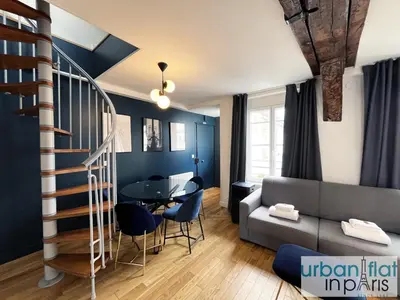 Coin salon dans l'établissement Urban Flat 176 - Charming 3 Bedroom in Montorgueil