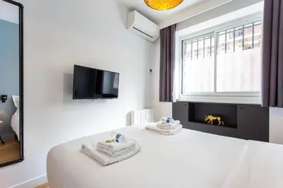 Un ou plusieurs lits dans un hébergement de l'établissement Magnificent apartment - 2BR-6P - Republique