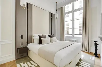 Un ou plusieurs lits dans un hébergement de l'établissement TheLander - Serviced Apartments in Louvre