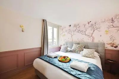 Un ou plusieurs lits dans un hébergement de l'établissement Beautiful apartment 2BR - 4P Republique Temple