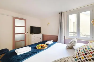 Un ou plusieurs lits dans un hébergement de l'établissement Beautiful apartment 2BR - 4P Republique Temple