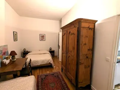 Un ou plusieurs lits dans un hébergement de l'établissement Appart Authentique et confortable - Marais Chapon