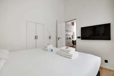 Un ou plusieurs lits dans un hébergement de l'établissement Apartment in the heart of the 9th arrondissement