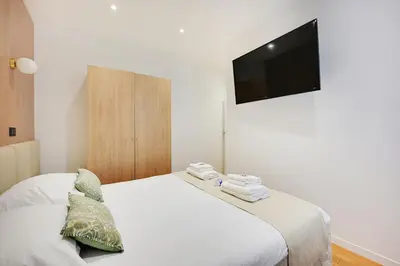 Un ou plusieurs lits dans un hébergement de l'établissement Charming apartment with terrasse - 1BDR- 6P - Sacré-Cœur
