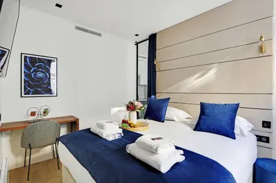 Un ou plusieurs lits dans un hébergement de l'établissement Luxury in the heart of Paris - 1BR-4P - Bourse