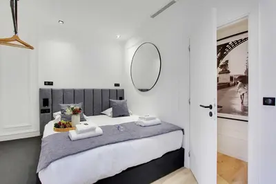 Un ou plusieurs lits dans un hébergement de l'établissement Luxury in the heart of Paris- 2BR-6P - Bourse