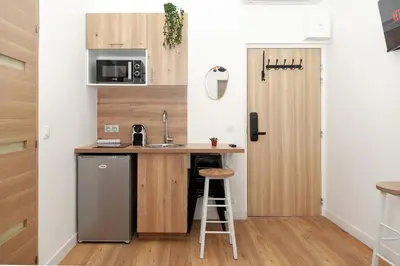 Cuisine ou kitchenette dans l'établissement Nets Inn apartments - La Coulée Verte