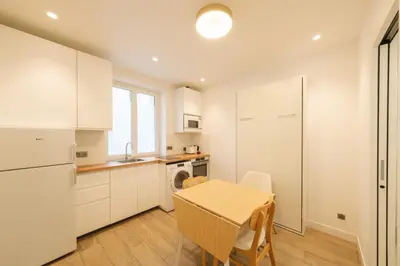 Cuisine ou kitchenette dans l'établissement Cosy apartment 3P - Place de l'Etoile