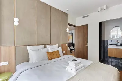 Un ou plusieurs lits dans un hébergement de l'établissement Exceptional 3 bedrooms Apartment Heart of Paris By Studio Prestige
