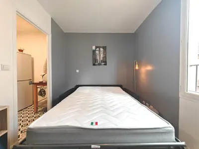 Un ou plusieurs lits dans un hébergement de l'établissement Cozy flat - Metro 13-14