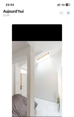 Un ou plusieurs lits dans un hébergement de l'établissement Appartement à côté du Sacrée cœur et Montmartre