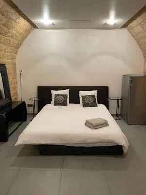 Un ou plusieurs lits dans un hébergement de l'établissement Superbe loft au coeur de Paris