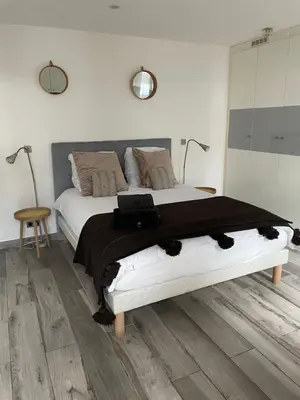 Un ou plusieurs lits dans un hébergement de l'établissement Superbe loft au coeur de Paris