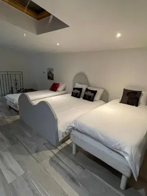 Un ou plusieurs lits dans un hébergement de l'établissement Superbe loft au coeur de Paris