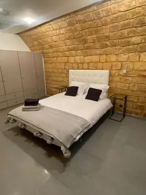 Un ou plusieurs lits dans un hébergement de l'établissement Superbe loft au coeur de Paris