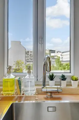 Cuisine ou kitchenette dans l'établissement Cosy Duplex