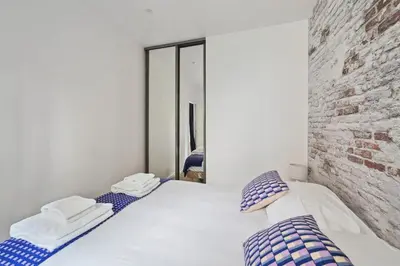 Un ou plusieurs lits dans un hébergement de l'établissement 540 Suite Meridien - Superbe Appartement à Paris