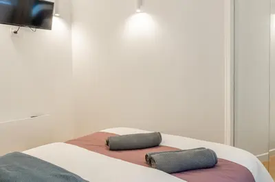 Un ou plusieurs lits dans un hébergement de l'établissement Lavie Maison AC and Balneo