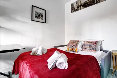 Un ou plusieurs lits dans un hébergement de l'établissement 542 Suite Montrouge - Appartement proche de Paris
