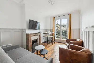 Coin salon dans l'établissement 550 Suite Quinault - Superbe Appartement à Paris